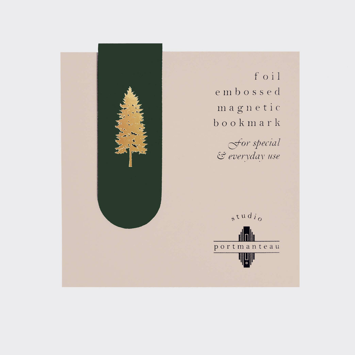 Foil embossed magnetic bookmark with tree design on beige background, Studio Portmanteau branding.