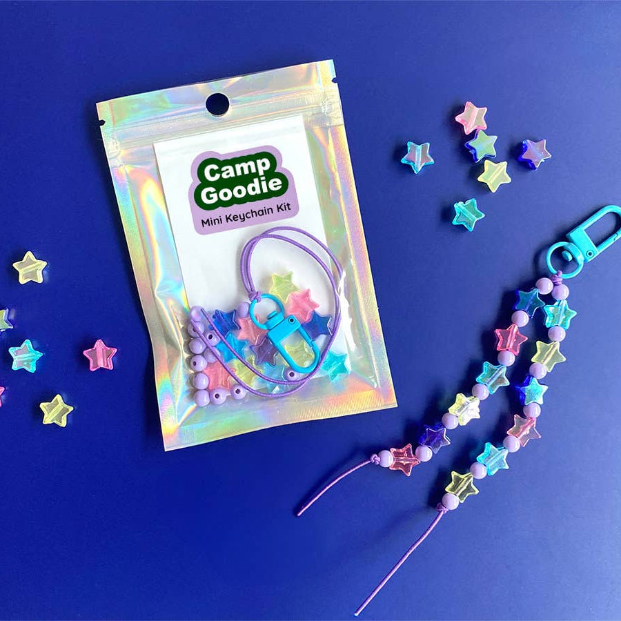 Camp Goodie mini keychain kit with colorful stars on a blue background