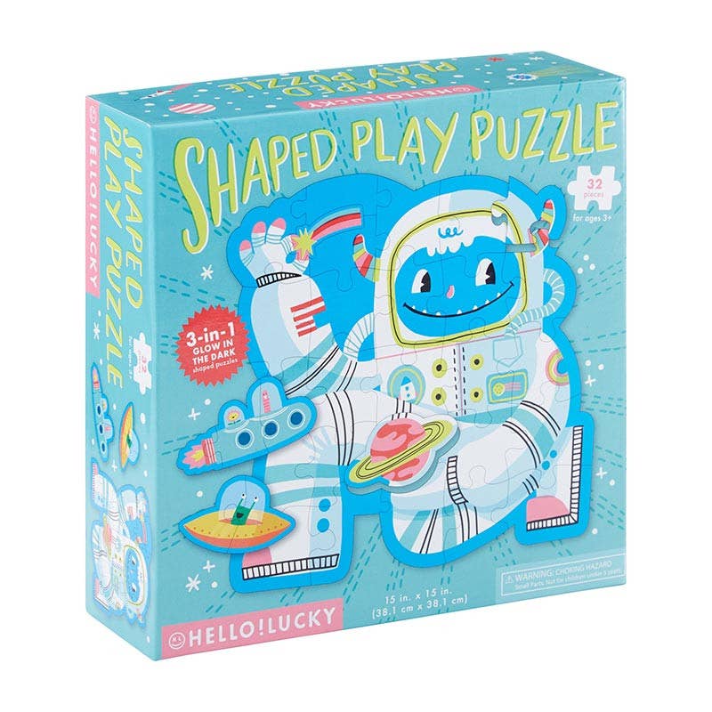 Box of a shaped play puzzle with an astronaut yeti design on a white background