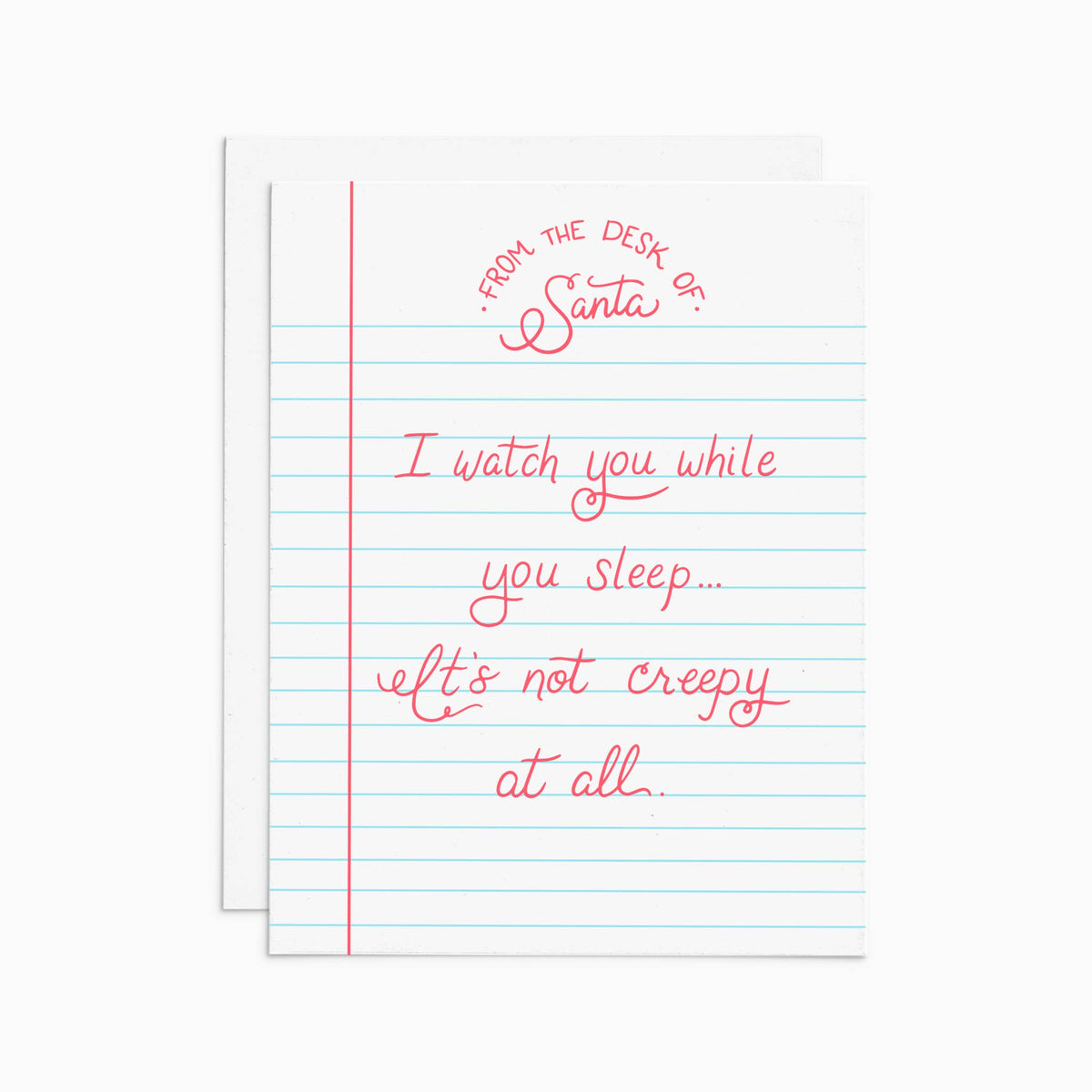 A white greeting card styled like lined notebook paper with a red vertical margin line and red handwritten text reading 'FROM THE DESK OF Santa: I watch you while you sleep.