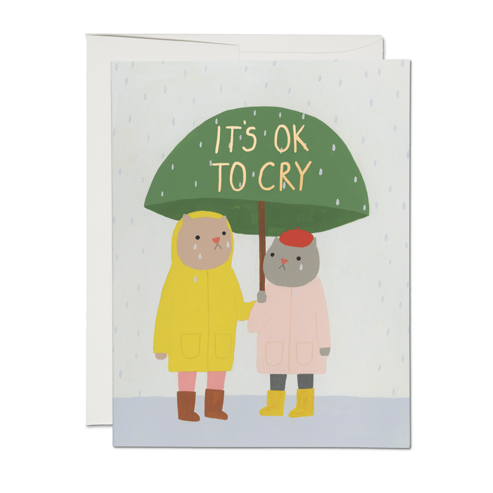 Card with two people under an umbrella and text 'It's Ok to Cry' on a white background