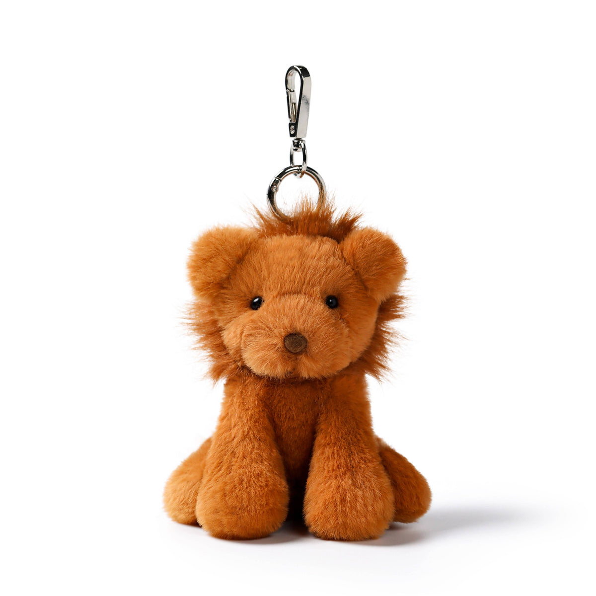 A small plush lion keychain in warm orange-brown, with a silver metal clasp at the top, photographed on a clean white background.