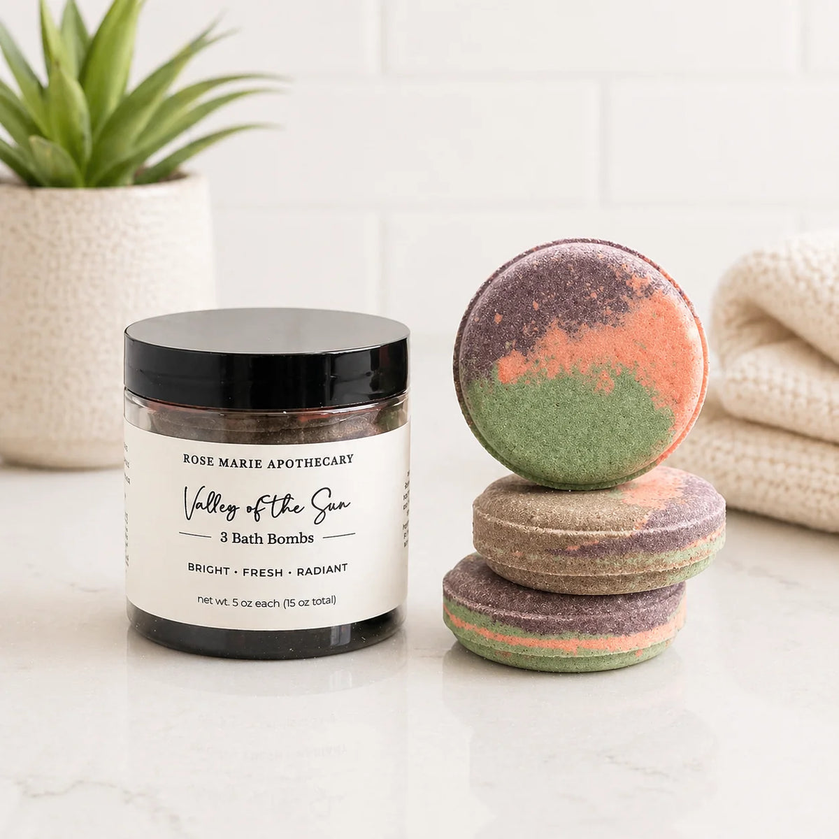 Bath bomb jar with multicolor bath bombs, labeled "Valley of the Sun" 