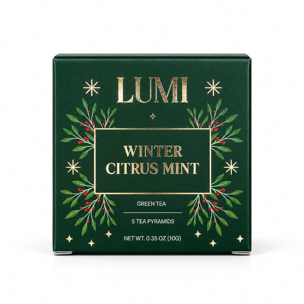 LUMI Winter Citrus Mint green tea box, featuring a dark forest green background with elegant gold foil lettering and a decorative wreath of green leaves and red berries.